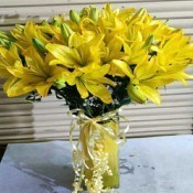 Yellow Lilies in a Glass Vase