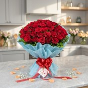 Red Rose Bouquet in Sky Blue Paper Packing with Greens