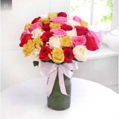 Arrangement of 35 Roses in a Glass Vase