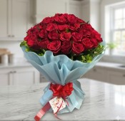 Red Rose Bouquet in Sky Blue Paper Packing with Greens