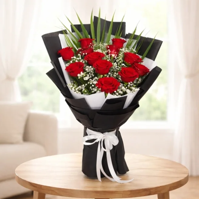 Red roses bouquet in black wrapping paper