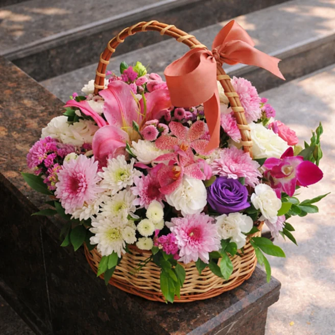 Mixed flower basket with lilies orchids roses and chrysanthemums arrangement delivery India